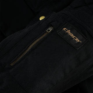 Close-up of the jacket's quilted bicep area, featuring a zippered patch pocket with a brass zipper and the distinct "chace racing" woven brand logo tag stitched above it.