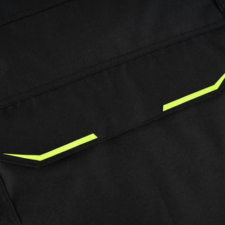 Extreme close-up of a jacket cargo pocket flap with black textile material accented by angular fluorescent hi-visibility yellow trim along the edges.