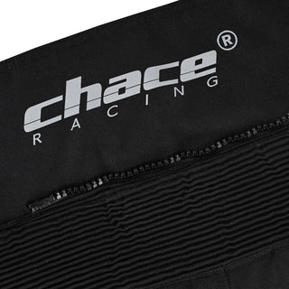 Close-up of the trousers' upper back, showing the Chace Racing logo just above the finely stitched, ribbed accordion stretch panel designed for lumbar flexibility.