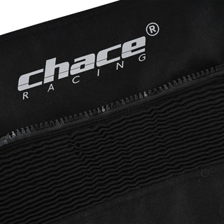 Close-up showing the "Chace Racing" logo on the textile material just above the finely stitched, ribbed knee accordion stretch panel.