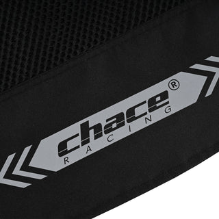 Extreme close-up of the lower back hem branding, showing the large, reflective "Chace Racing" logo flanked by reflective arrow graphics on the black textile.