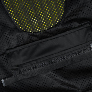 Close-up of the jacket's interior back area, showing the porous mesh lining, a heavy-duty zipper, and a padded yellow/black protector pad partially visible inside the dedicated armor pocket.