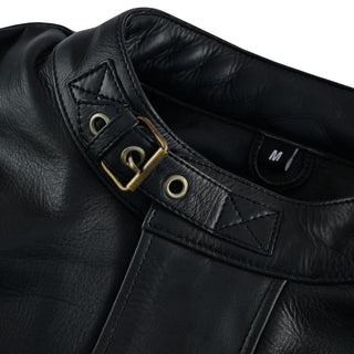 Close-up of the black leather stand collar, showing the adjustable throat latch strap secured with a small brass buckle and eyelets.