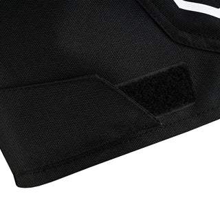 Close-up of the jacket's lower hem, showing a secured textile flap with visible black hook-and-loop (Velcro) material, used for side/hip adjustment.