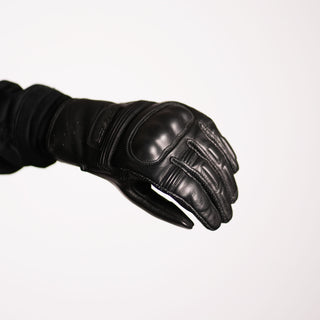 Side and palm view of the glove, showing the natural pre-curved finger shape for comfort and the smooth leather over the palm area.