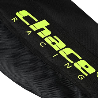 Extreme close-up of the jacket sleeve showing the large, stylized "Chace Racing" logo printed in fluorescent hi-visibility yellow on the black textile fabric.