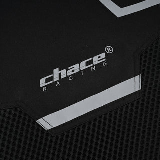 Close-up of the lower front portion of the jacket, showing the transition from the textile material to the hexagonal mesh panel, along with the "Chace Racing" logo and a reflective strip.